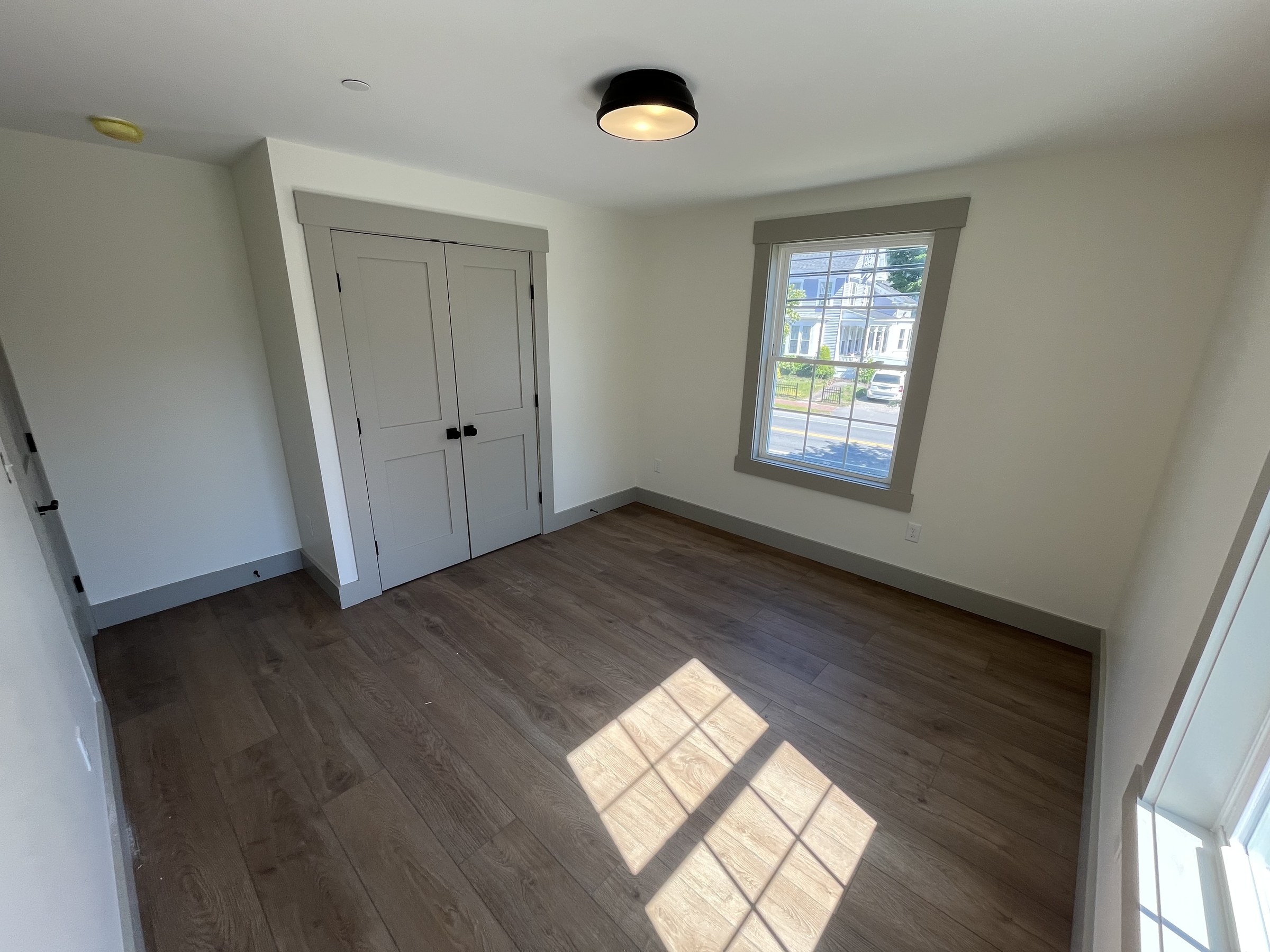 Bedroom with hardwood-style flooring at 114 Silver St